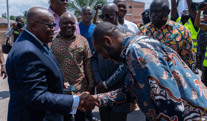 President Akufo-Addo in a handshake with Energy Minister Dr Mathew Opoku Prempeh